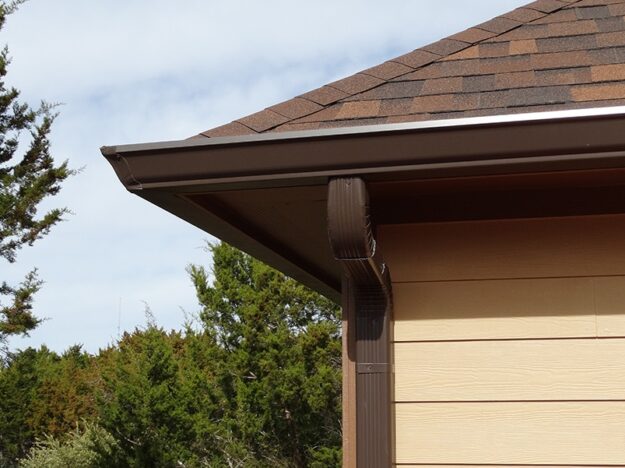corner of brown metal gutters