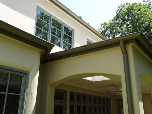 front porch with grey gutters and downspout