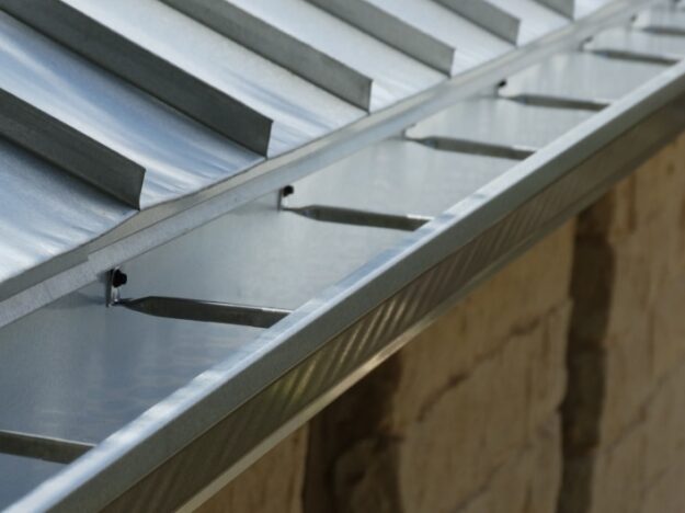 silver metal rain gutters with leaf guards