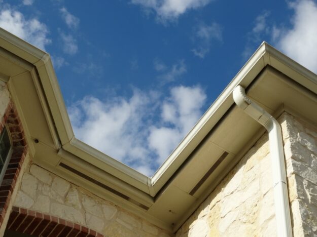 off white gutters with edge joining and downspout