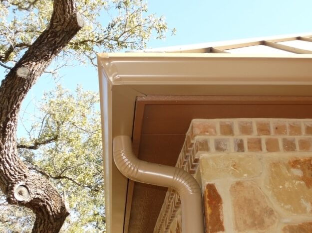 standard 6 inch gutters in San Antonio, TX installed on a brick house