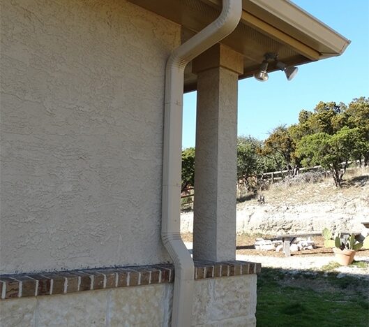 tan rain gutters and downspout