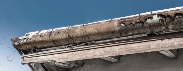 rain gutter affected by hail storm rain gutter affected by hail storm