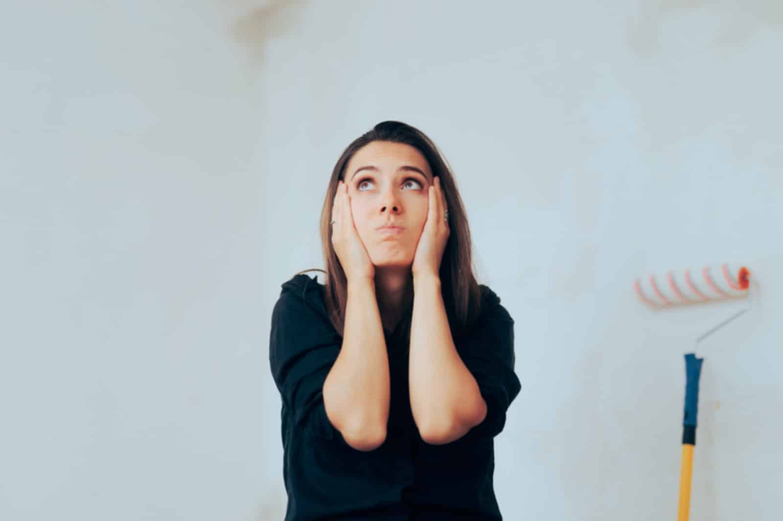 women stressed about painting her home herself woman stressed about painting her home herself